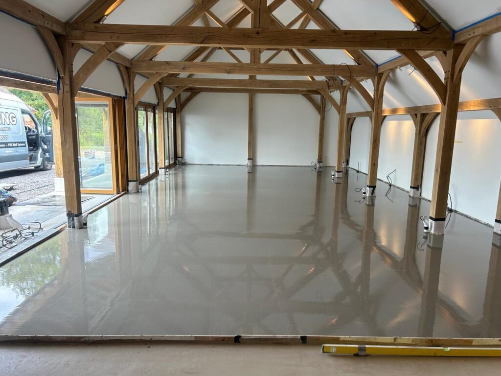 Latex levelling compound being laid on a floor