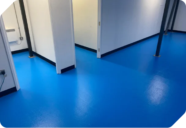 Blue safety vinyl flooring fitted in a commercial changing area
